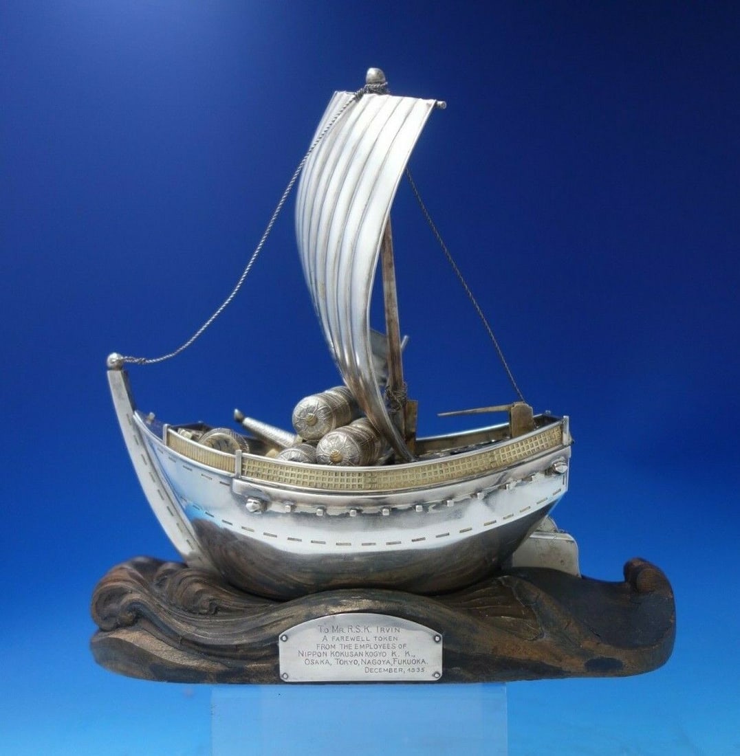 Japanese .950 Silver Ship Sculpture with Sail Faux Gold Barrels Wood Base 10 1/4" Tall: Japanese .950 Silver Ship Sculpture with Sail Faux Gold Barrels Wood Base 10 1/4" Tall This exquisite Japanese sculpture showcases a .950 silver ship with a sail, elegantly adorned with faux gold barr