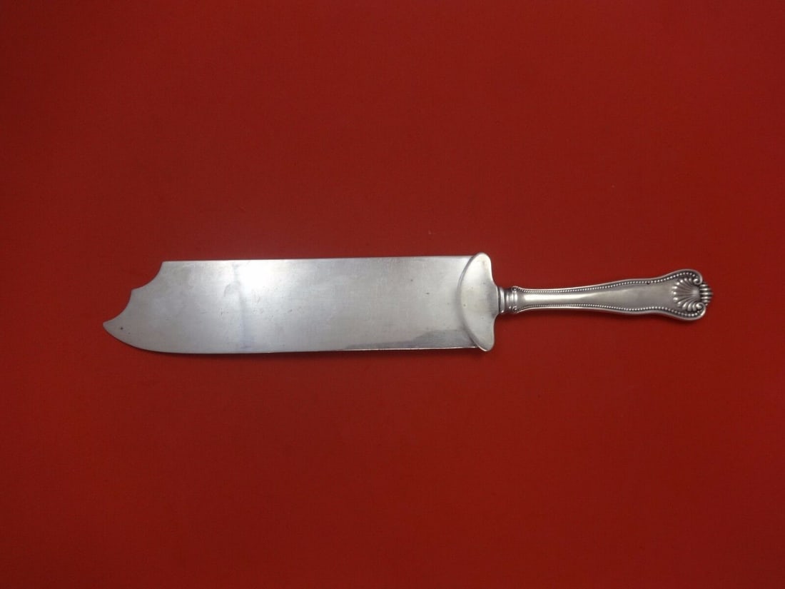 Frank Smith Newport Shell Sterling Silver Ice Cream Slice 12": Frank Smith Newport Shell Sterling Silver Ice Cream Slice 12" Add elegance to your dessert serving with this exquisite 12" ice cream slice from Frank Smith, crafted in all sterling silver. This piece