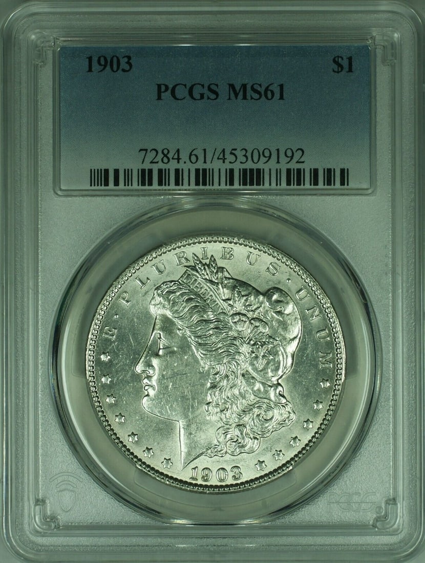 1903 Morgan Silver Dollar Coin Uncirculated PCGS MS61 Silver: 1903 Morgan Silver Dollar Coin Uncirculated PCGS MS61 Silver This 1903 Morgan Silver Dollar Coin is a stunning addition for collectors. The coin is uncirculated, showcasing its excellent condition wit