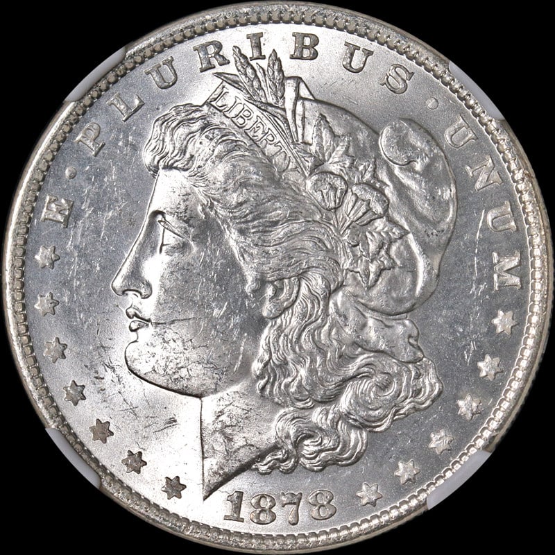 1878-P Morgan Silver Dollar NGC MS62 Uncirculated Blazing White: 1878-P Morgan Silver Dollar NGC MS62 Uncirculated Blazing White This stunning 1878-P Morgan Silver Dollar is certified by NGC with a grade of MS62, indicating it is uncirculated and exhibits a strong 