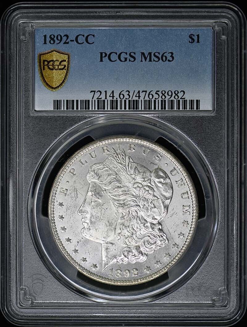 1892-CC Morgan Dollar Uncirculated PCGS MS63 Certified Coin: 1892-CC Morgan Dollar Uncirculated PCGS MS63 Certified Coin This 1892-CC Morgan Dollar is a remarkable piece, certified by PCGS with a grade of MS63. Minted in Carson City, this uncirculated coin show