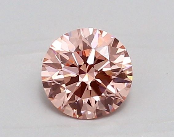 Ideal Loose Diamond - ROUND 0.73ct Fancy Vivid Pink VS1: Ideal Loose Diamond - ROUND 0.73ct Fancy Vivid Pink VS1 Source: This is a real non-mined Diamond that has been grown in a lab Shape: ROUND Carats: 0.73 Color: Fancy Vivid Pink Certification: IGI Video