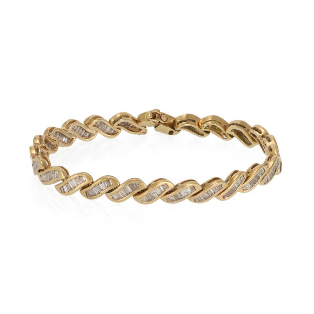 14k Yellow Gold Diamond Channel Set Tennis Bracelet: 14k Yellow Gold Diamond Channel Set Tennis Bracelet This stunning bracelet is expertly crafted from 14k yellow gold, showcasing a sophisticated slanted pattern with curved bar links. Each link is ador