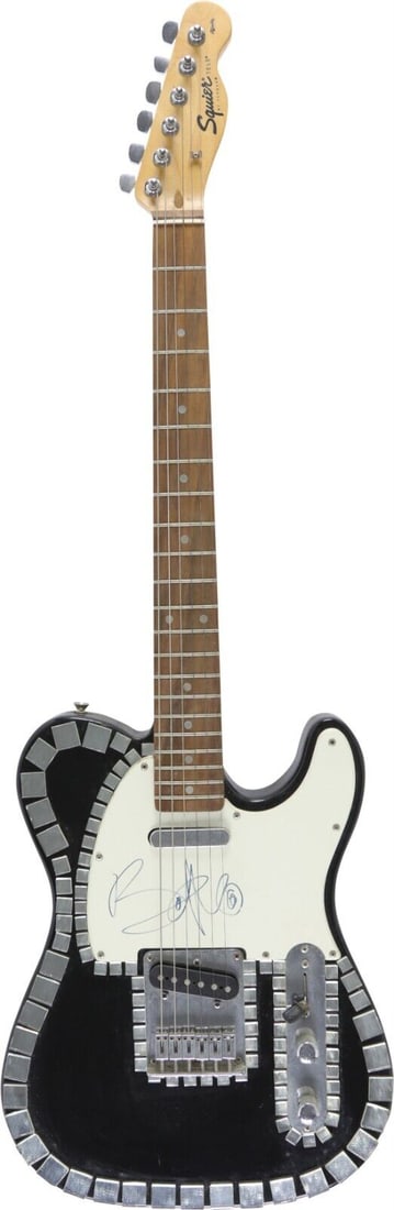 Bono Signed Fender Squire Tele Guitar with JSA COA: Bono Signed Fender Squire Tele Guitar with JSA COA This is a Fender Squire Tele guitar autographed by Bono, the iconic lead singer of U2. The guitar features a striking black and white design and is s