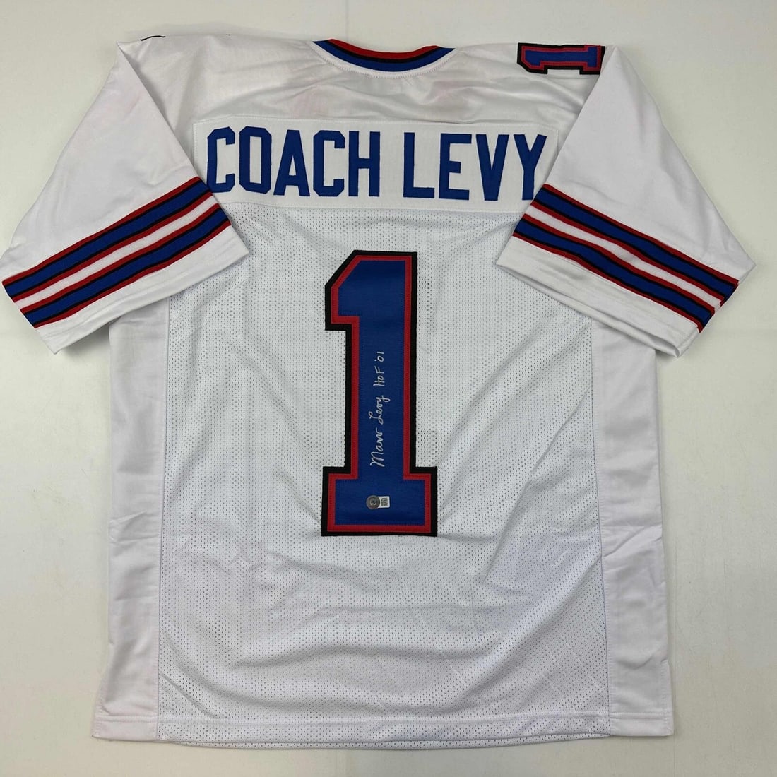 Autographed Marv Levy Buffalo Bills Jersey Beckett Authenticated HOF 01: Autographed Marv Levy Buffalo Bills Jersey Beckett Authenticated HOF 01 This autographed Marv Levy jersey is a must-have for any Buffalo Bills fan. Featuring the Hall of Fame coach's signature, this w