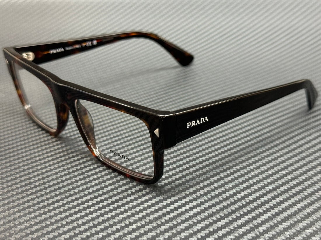 PRADA PR A01V 17N1O1 Brown Havana Men's Eyewear: PRADA PR A01V 17N1O1 Brown Havana Men's Eyewear Elevate your eyewear collection with these PRADA PR A01V 17N1O1 Brown Havana Men's Eyeglasses. Featuring a stylish brown frame, these eyeglasses are des