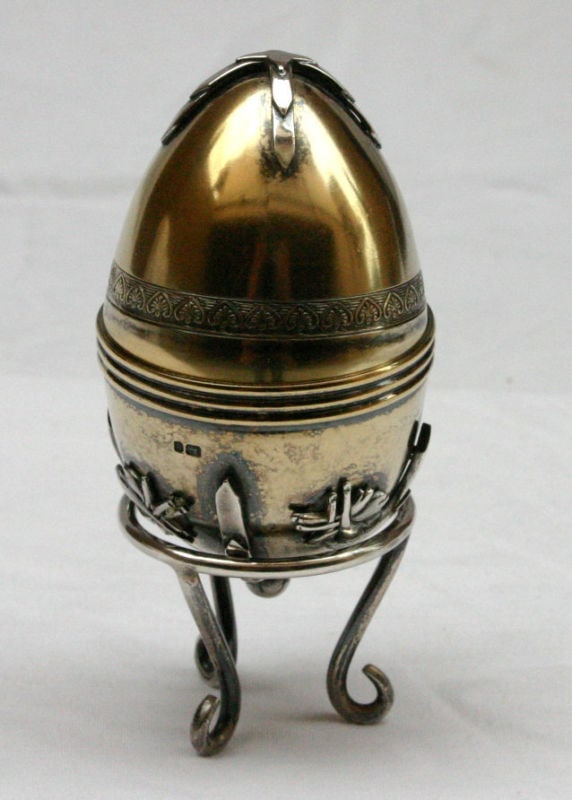 1900 English Sterling Silver Egg with Stand and Hallmarks: 1900 English Sterling Silver Egg with Stand and Hallmarks Discover the elegance of this exquisite 1900's English sterling silver egg, beautifully presented on a matching sterling silver stand. The int