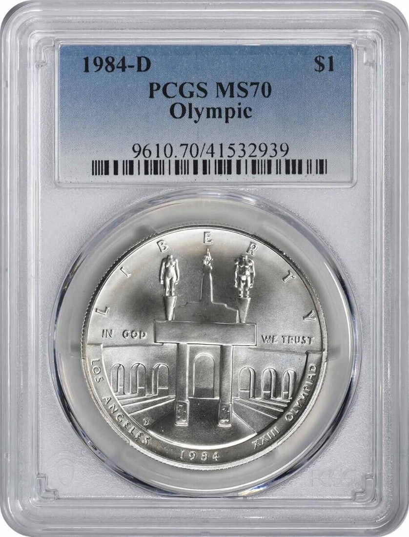 1984-D Olympic Silver Dollar MS70 PCGS Commemorative Coin by Robert Graham: 1984-D Olympic Silver Dollar MS70 PCGS Commemorative Coin by Robert Graham This 1984-D Olympic Silver Commemorative Dollar is a stunning piece in Mint State 70 (MS70) condition, certified by PCGS. Str