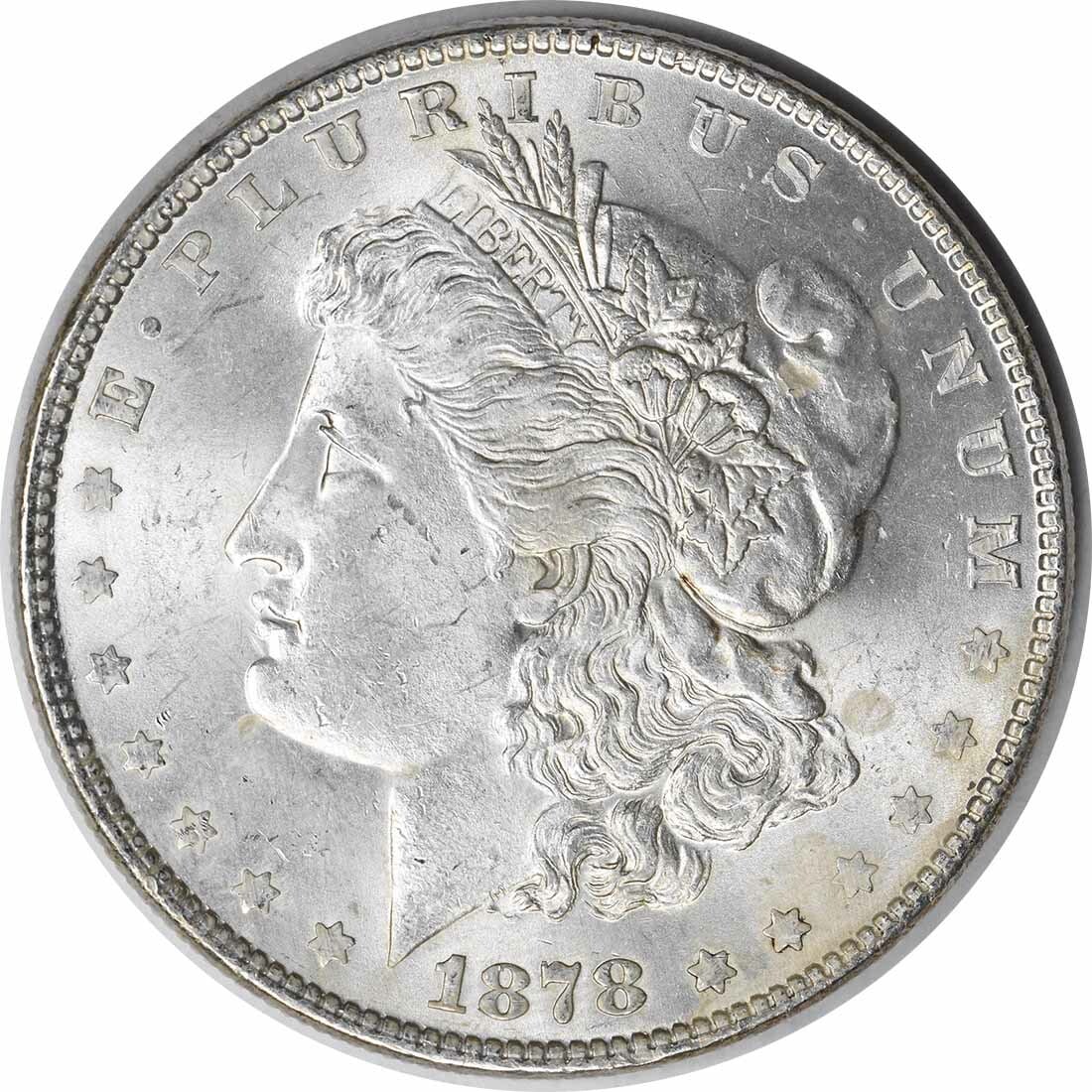 1878 Morgan Silver Dollar Choice BU Uncertified Silver Coin: 1878 Morgan Silver Dollar Choice BU Uncertified Silver Coin This 1878 Morgan Silver Dollar showcases a stunning Choice BU grade, representing an uncirculated specimen from a year rich in numismatic hi