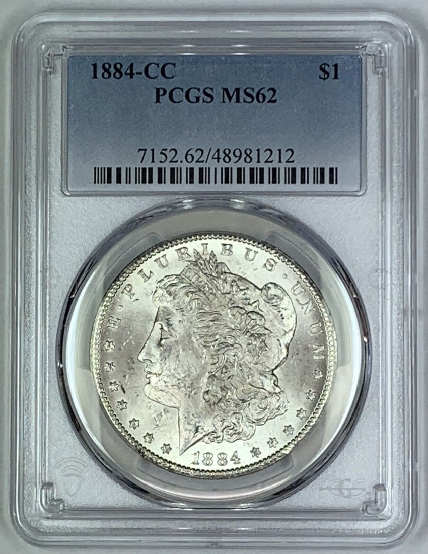 1884-CC Morgan Silver Dollar Coin PCGS MS 62 Uncirculated: 1884-CC Morgan Silver Dollar Coin PCGS MS 62 Uncirculated This 1884-CC Morgan Silver Dollar coin is a remarkable collectible piece, graded MS 62 by PCGS, indicating its uncirculated condition. Minted 
