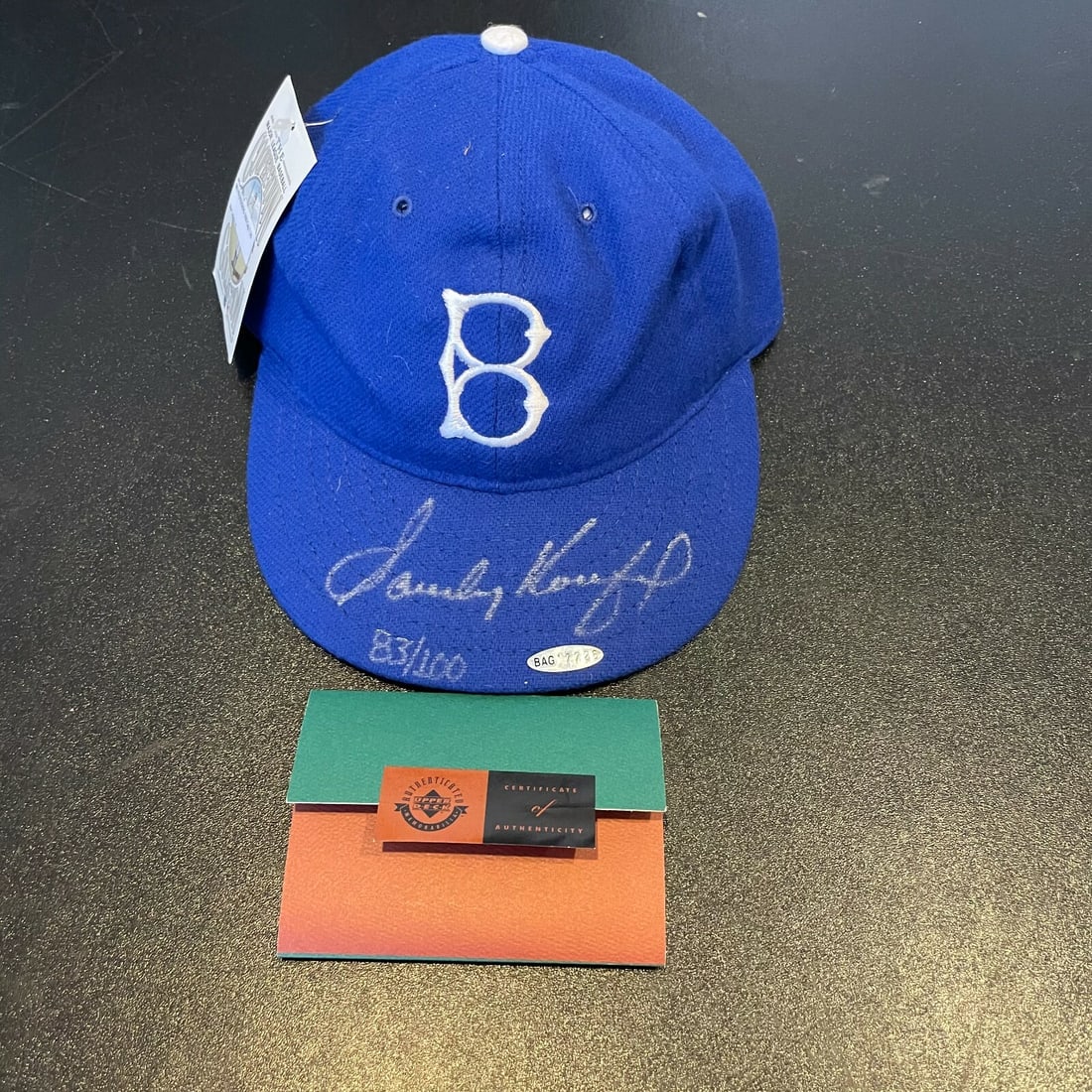 Sandy Koufax Signed Brooklyn Dodgers Hat UDA COA 83/100: Sandy Koufax Signed Brooklyn Dodgers Hat UDA COA 83/100 This original Brooklyn Dodgers game model hat features a stunning signature from baseball legend Sandy Koufax. Authenticated by Upper Deck (UDA)