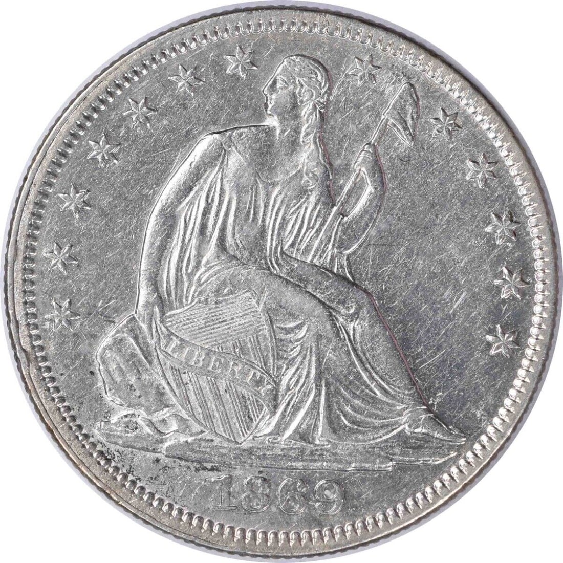 1869 Liberty Seated Half Dollar AU Uncertified 50C Silver Coin: 1869 Liberty Seated Half Dollar AU Uncertified 50C Silver Coin This 1869 Liberty Seated Silver Half Dollar showcases a beautiful design by Thomas Sully and Christian Gobrecht. It is classified as an A