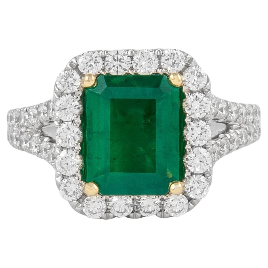 GIA 2.76ctt Emerald Cut Emerald and Diamond Halo Ring 18k Gold: GIA 2.76ctt Emerald Cut Emerald and Diamond Halo Ring 18k Gold This stunning GIA certified halo ring features a captivating 2.76 carats total gemstone weight, including a vibrant 1.85 carat emerald cu
