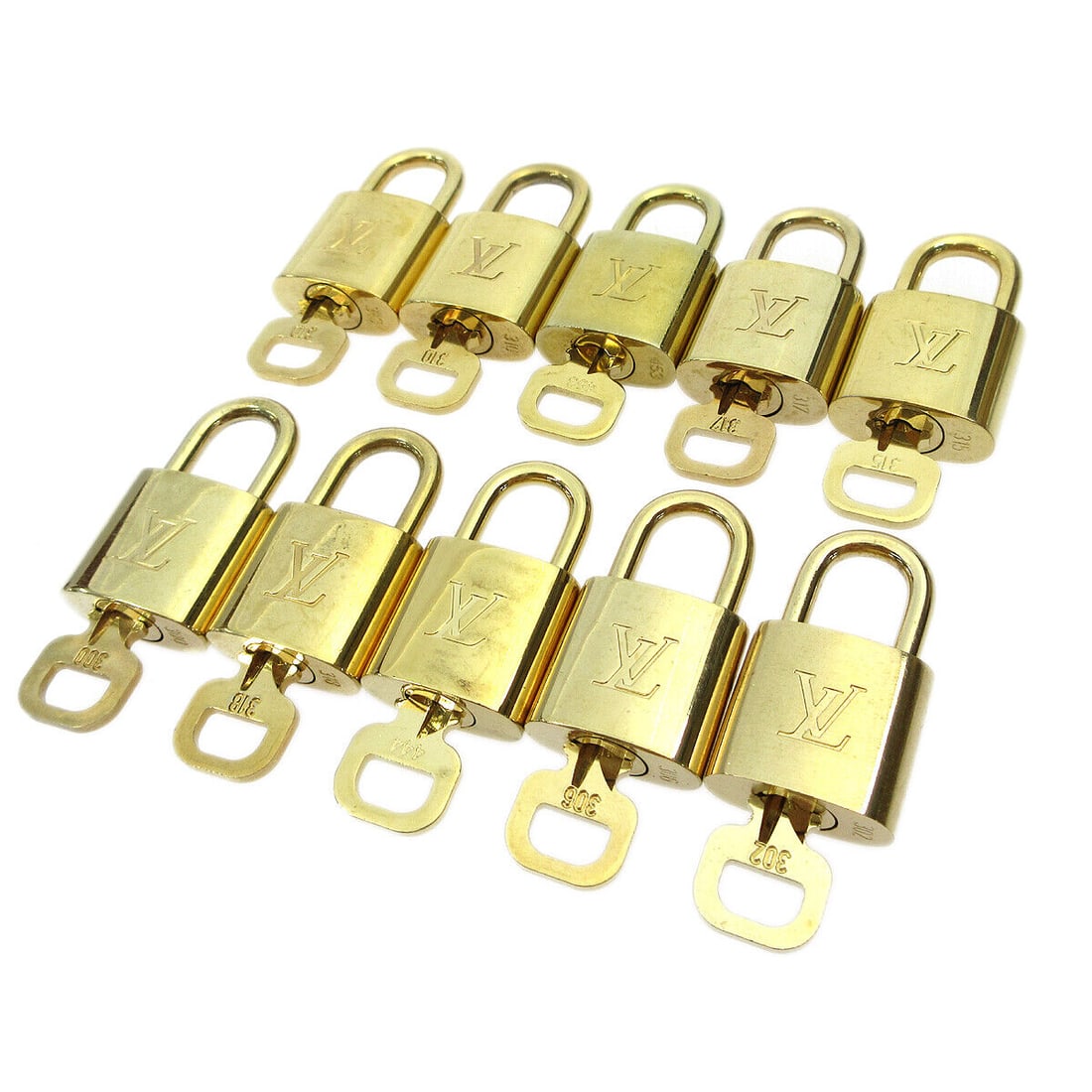 Louis Vuitton Gold Padlock & Key Bag Accessories 10 Piece Set: Louis Vuitton Gold Padlock & Key Bag Accessories 10 Piece Set Enhance your collection with this exquisite 10 Piece Set of Padlock & Key Bag Accessories Charm by Louis Vuitton. Each piece features a lu