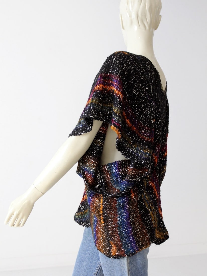 1970s Vintage Metallic Butterfly Sleeve Sweater Boho Style 40 in Waist: 1970s Vintage Metallic Butterfly Sleeve Sweater Boho Style 40 in Waist Step back into the vibrant 1970s with this vintage metallic butterfly sleeve sweater. Featuring a unique draped knit design, this