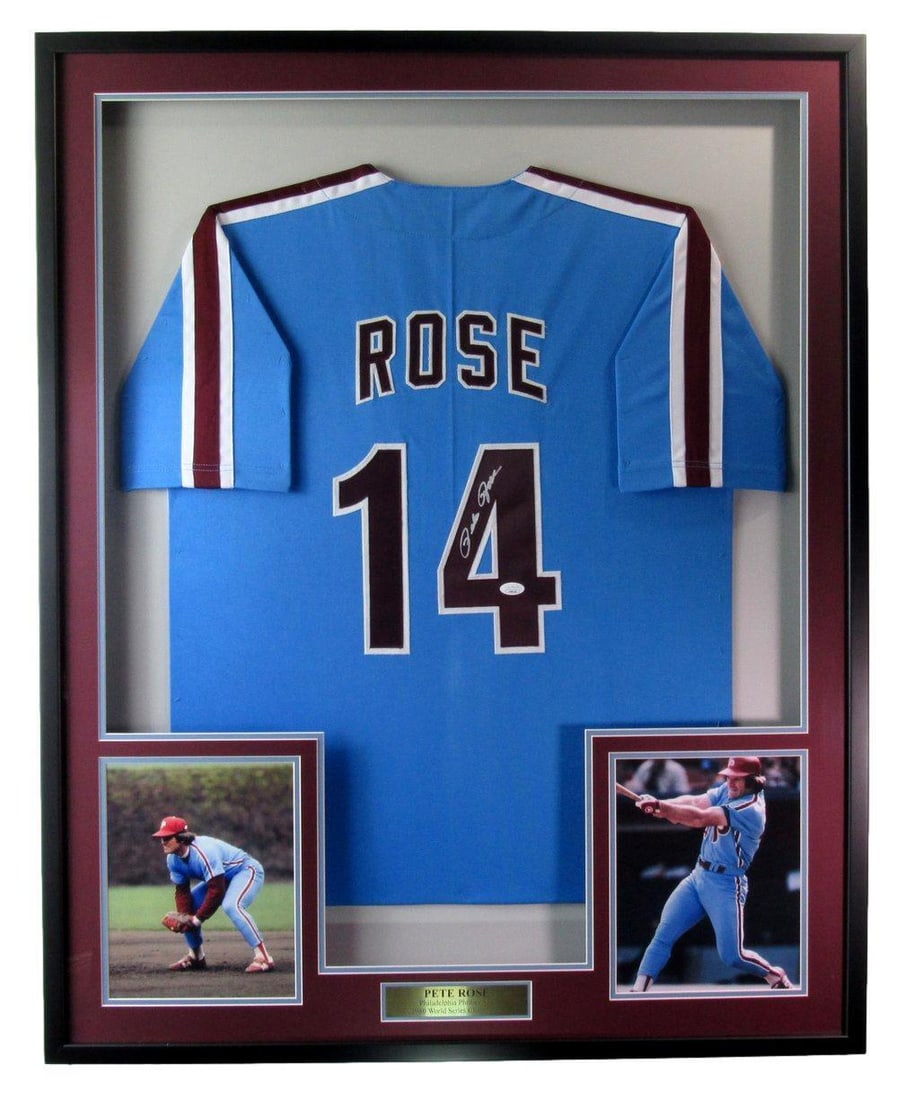 Pete Rose Signed Philadelphia Phillies Framed Jersey JSA 191949: Pete Rose Signed Philadelphia Phillies Framed Jersey JSA 191949 This is an original blue Philadelphia Phillies baseball jersey signed by Pete Rose, expertly framed for display. The jersey is in pre-ow