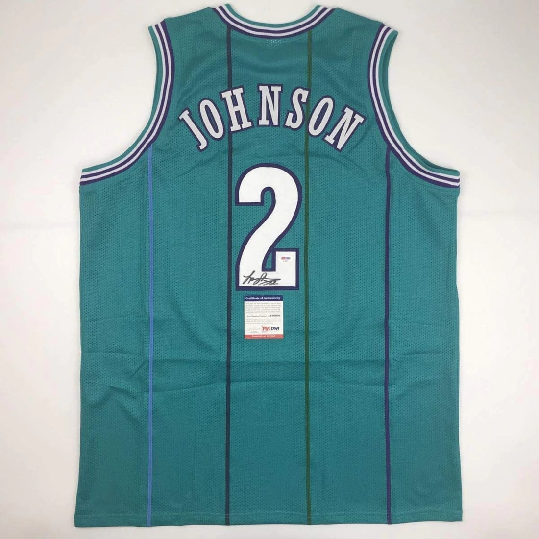 Larry Johnson Autographed Charlotte Hornets Basketball Jersey PSA/DNA COA: Larry Johnson Autographed Charlotte Hornets Basketball Jersey PSA/DNA COA This authentic Charlotte Hornets basketball jersey is autographed by NBA star Larry Johnson, showcasing his signature as a tes