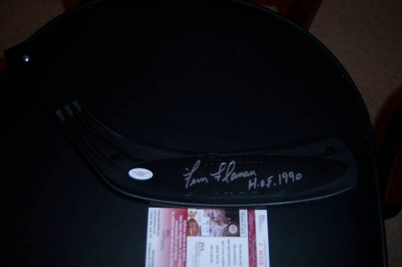 Fern Flaman Signed Bruins Hockey Stick HOF Collectible: Fern Flaman Signed Bruins Hockey Stick HOF Collectible This official hockey stick is signed by Fern Flaman, a Hall of Fame player, making it a valuable collectible for any Bruins fan. The stick repres