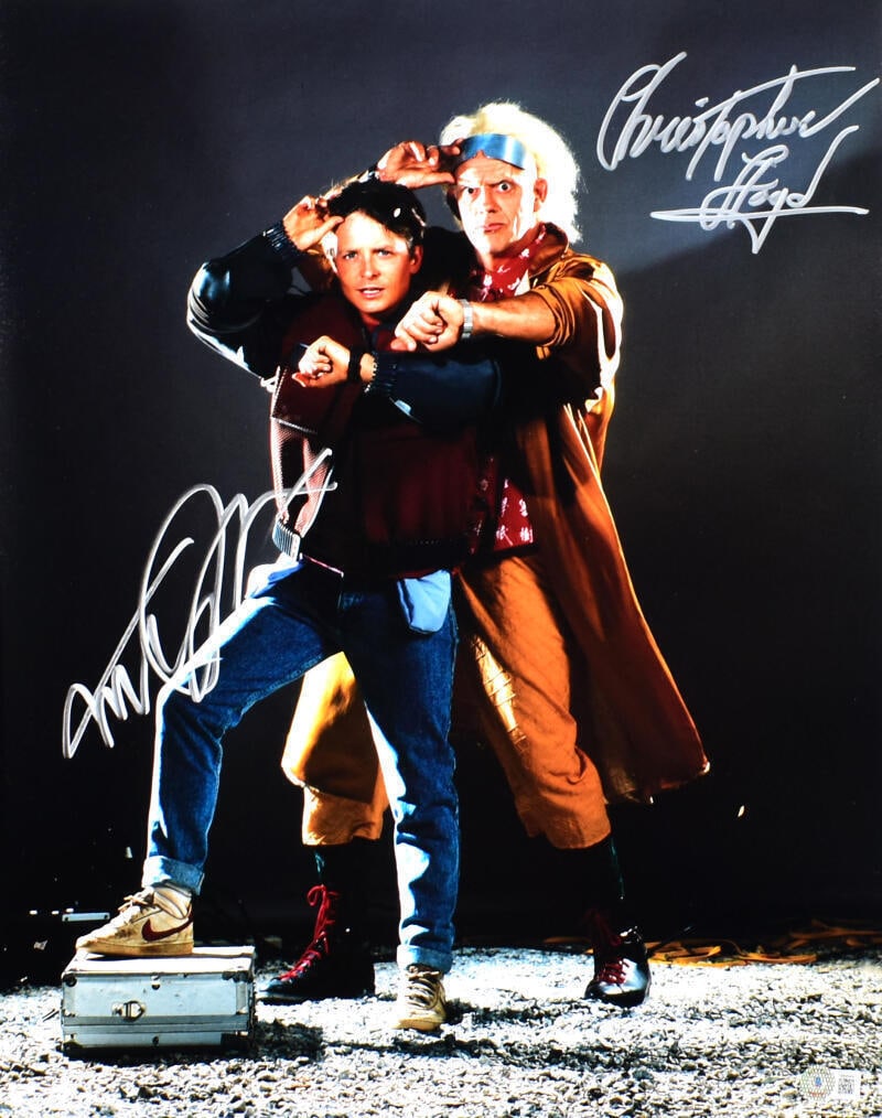 Back to the Future 16x20 Photo Signed by Lloyd and Fox Beckett Authenticated: Back to the Future 16x20 Photo Signed by Lloyd and Fox Beckett Authenticated This striking 16x20 photograph from the iconic movie "Back to the Future" features the signatures of legendary actors Chris