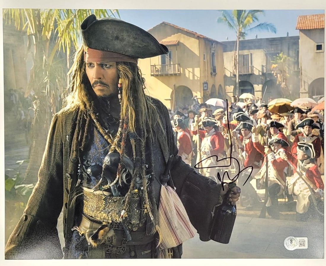 Johnny Depp Autographed Pirates of the Caribbean 11x14 Photo Beckett Authenticated: Johnny Depp Autographed Pirates of the Caribbean 11x14 Photo Beckett Authenticated This is an original 11x14 photograph signed by Johnny Depp, showcasing his iconic role in the Pirates of the Caribbea