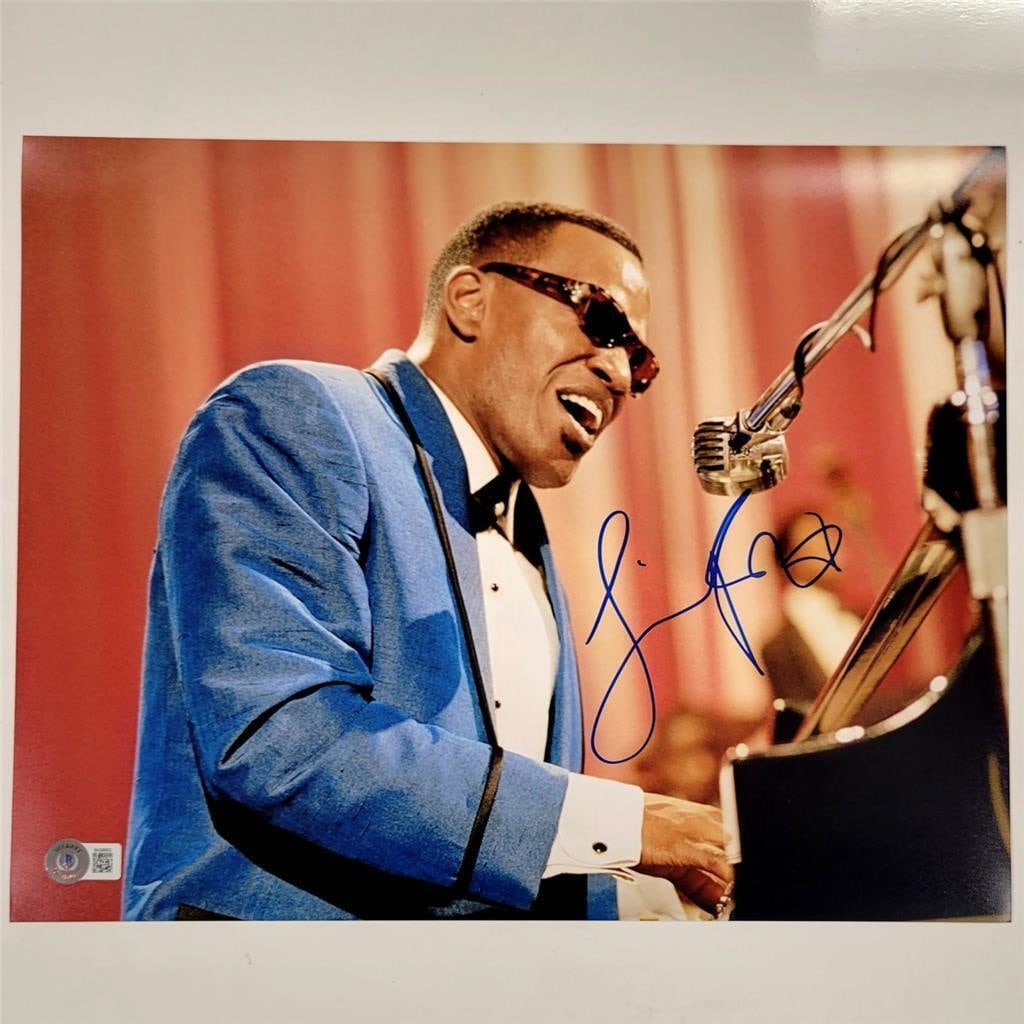 Jamie Foxx Signed 11x14 Ray Charles Photo Beckett Certified: Jamie Foxx Signed 11x14 Ray Charles Photo Beckett Certified This 11x14 photograph captures the iconic portrayal of Ray Charles by Jamie Foxx in the acclaimed movie 'Ray.' The photo features an authent