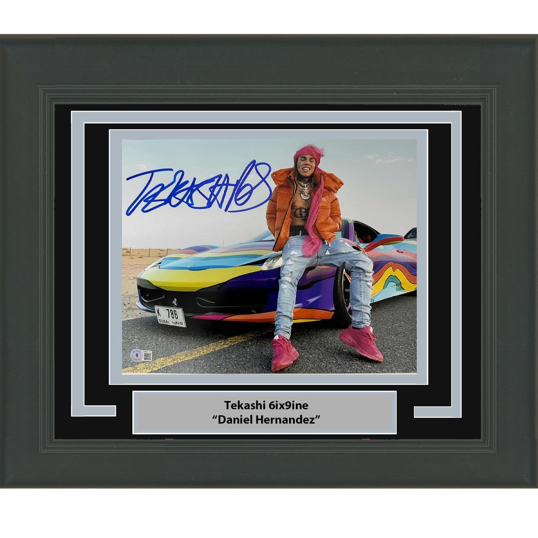 Framed Signed Tekashi 6ix9ine 11x14 Photo with Beckett COA: Framed Signed Tekashi 6ix9ine 11x14 Photo with Beckett COA This framed 11x14 photo features a striking image of Tekashi 6ix9ine, also known as Daniel Hernandez. The photo is autographed by the artist,