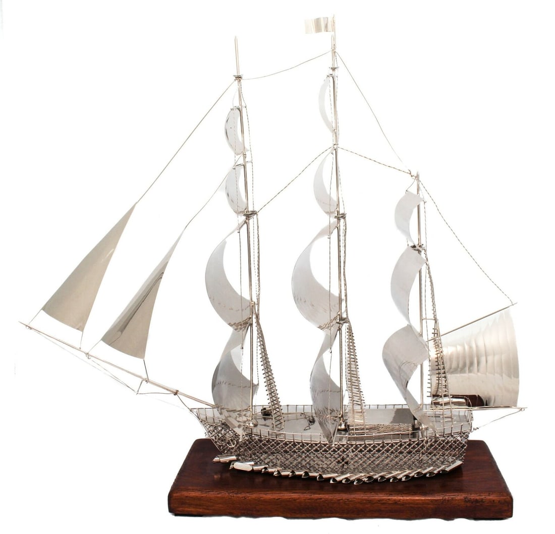 Large Italian Silver Plated Sailboat with Wooden Stand 22x19.75 inches: Large Italian Silver Plated Sailboat with Wooden Stand 22x19.75 inches This exquisite large sailboat features a stunning combination of Italian silver plating and a wooden stand, showcasing intricate