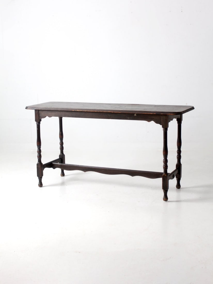 Victorian Antique Console Table Dark Wood 60 x 20 x 30.25: Victorian Antique Console Table Dark Wood 60 x 20 x 30.25 This is an antique Victorian console table. The wooden sofa table has a dark finish with turned legs and a decoratively carved apron and stret