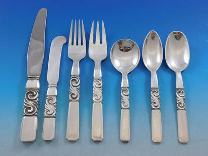 Georg Jensen Scroll Sterling Silver Flatware Set 45 Pieces 1900-1940: Georg Jensen Scroll Sterling Silver Flatware Set 45 Pieces 1900-1940 Experience the elegance of the Scroll pattern flatware set by Georg Jensen, crafted from sterling silver and dating from 1900 to 19