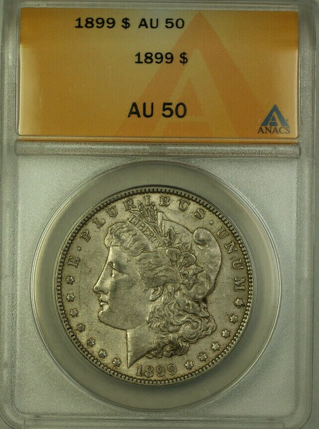 1899 Morgan Silver Dollar ANACS AU 50 Silver Coin: 1899 Morgan Silver Dollar ANACS AU 50 Silver Coin This 1899 Morgan Silver Dollar is a stunning piece, certified by ANACS with a grade of AU 50. Minted in Philadelphia, this coin features a composition