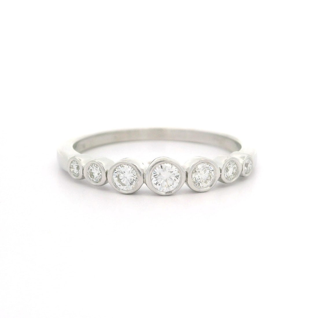 Tiffany & Co. Platinum 0.31ct Graduated Bezel Diamond Band Ring: Tiffany & Co. Platinum 0.31ct Graduated Bezel Diamond Band Ring This exquisite Tiffany & Co. band ring features a stunning graduated bezel design, showcasing a total carat weight of 0.31ct of natural 
