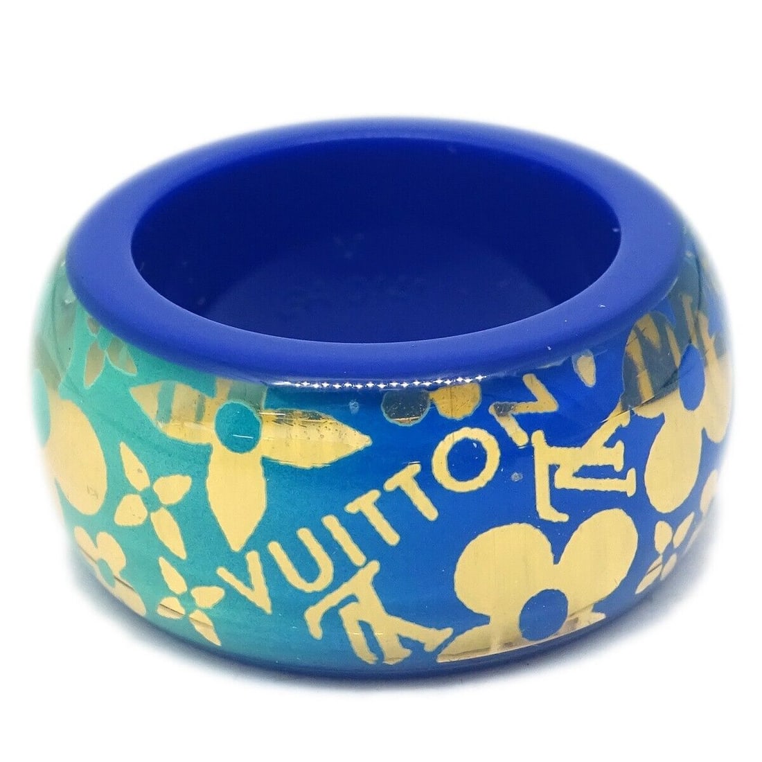 Louis Vuitton Vintage Blue Acrylic Tropical Cocktail Ring Size 12: Louis Vuitton Vintage Blue Acrylic Tropical Cocktail Ring Size 12 This stunning Louis Vuitton Blue Burg Tropical Cocktail Ring is a vintage piece that showcases a vibrant blue color, perfect for addin