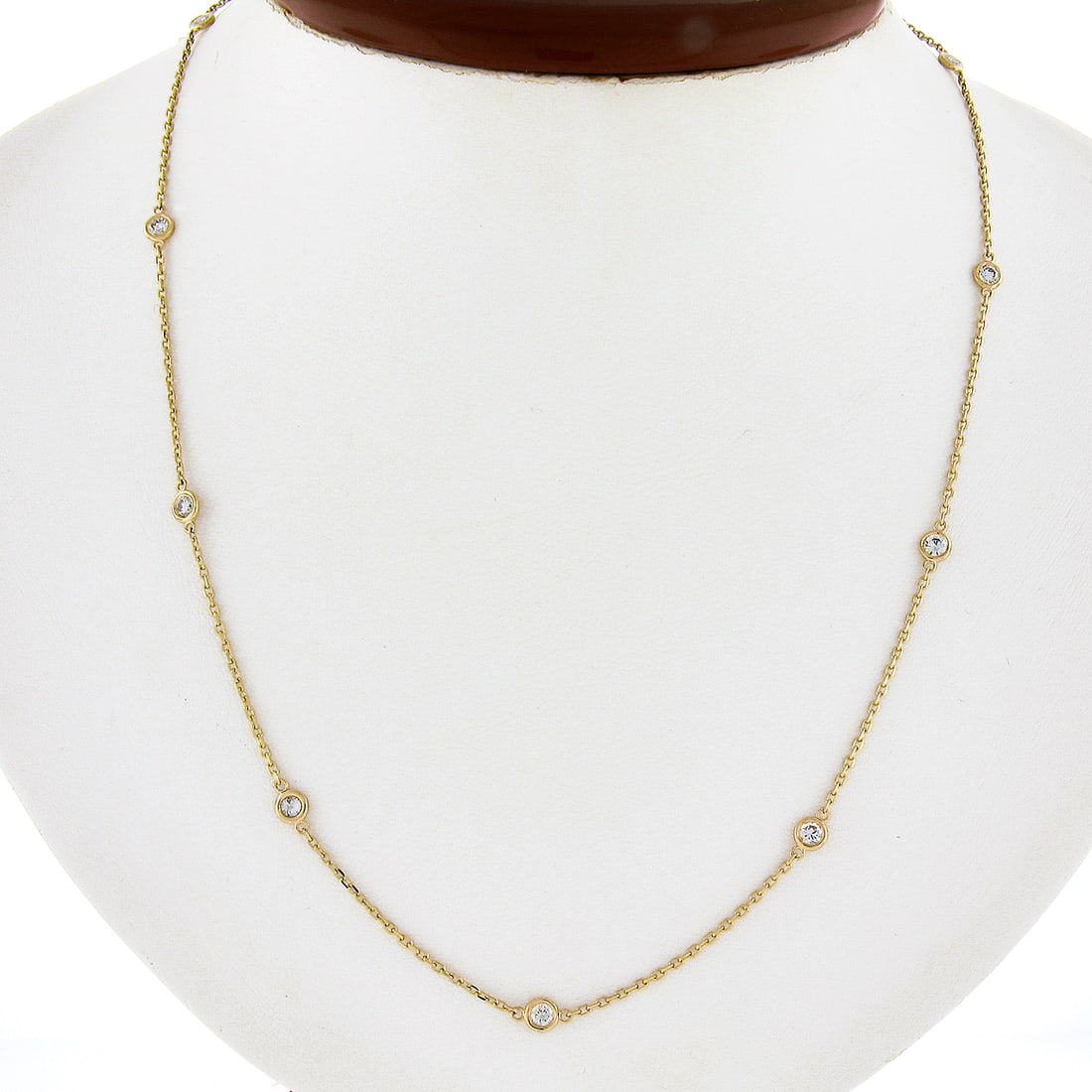 14K Yellow Gold .73ct Bezel Set Diamond By the Yard Necklace: 14K Yellow Gold .73ct Bezel Set Diamond By the Yard Necklace This exquisite 14K Yellow Gold Necklace features a stunning design with .73ct of round diamonds set in a bezel station style, making it per