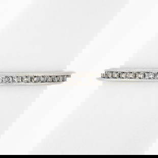 Vintage Platinum Engraved 0.80ct Channel Set Diamond Eternity Band: Vintage Platinum Engraved 0.80ct Channel Set Diamond Eternity Band This exquisite vintage eternity band ring features a total carat weight of 0.75 ctw - 0.99 ctw, beautifully channel-set with 40