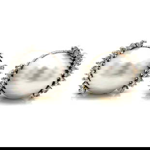 Vintage 1960s Platinum Mabe Pearl 0.80 Ct Diamond Earrings: Vintage 1960s Platinum Mabe Pearl 0.80 Ct Diamond Earrings These exquisite vintage earrings from the 1960s feature stunning Mabe pearls and sparkling diamonds. Crafted in luxurious platinum, the