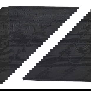 Chanel Travel Line Black Jacquard Nylon Bifold Wallet: Chanel Travel Line Black Jacquard Nylon Bifold Wallet This elegant Chanel Travel Line Bifold Wallet in black features a classic CC pattern. Made from durable jacquard nylon, it combines style and