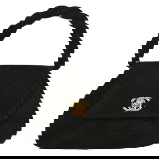 Chanel Black Nubuck Mini Top Handle Handbag with Turn Lock: Chanel Black Nubuck Mini Top Handle Handbag with Turn Lock This elegant Chanel Black Suede Handbag is perfect for casual occasions. Crafted from high-quality nubuck, it features a chic turn lock