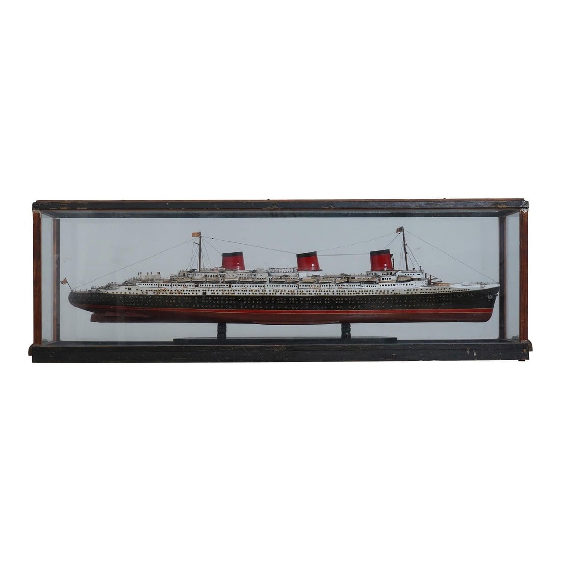 Handcrafted 80 Year Old SS Normandie Wood Model in Glass Case: Handcrafted 80 Year Old SS Normandie Wood Model in Glass Case This exquisite vintage model of the SS Normandie cruise ship is a remarkable handcrafted piece, showcasing intricate details that reflect
