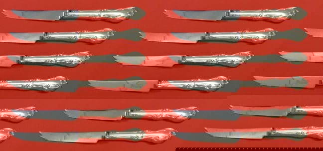 International Sterling Silver Joan of Arc Steak Knife Set 12 pcs 8 1/2": International Sterling Silver Joan of Arc Steak Knife Set 12 pcs 8 1/2" This exquisite Joan of Arc steak knife set by International Sterling Silver includes 12 pieces, each measuring 8 1/2". The