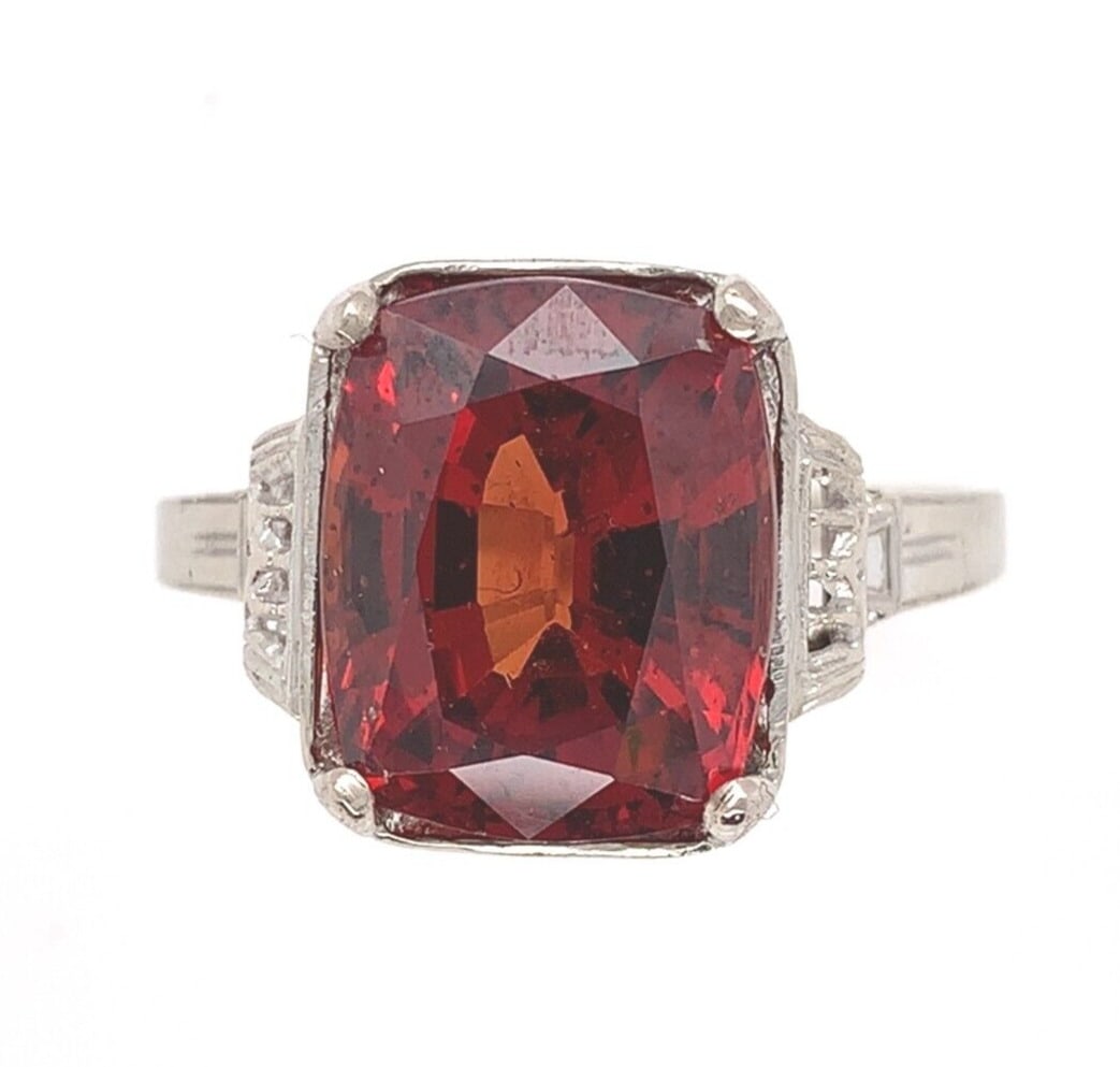 Vintage 14k White Gold 7.49ct Malaya Garnet Cushion Ring Size 8.25: Vintage 14k White Gold 7.49ct Malaya Garnet Cushion Ring Size 8.25 This exquisite vintage ring features a stunning 7.49 carat genuine Malaya garnet, beautifully set in 14k white gold. The garnet, show