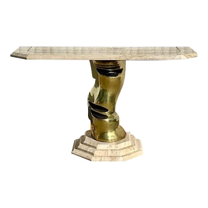 Vintage Boho Console Table with Brass Pedestal and Stone Top: Vintage Boho Console Table with Brass Pedestal and Stone Top This exquisite vintage Boho console table features a chic sculpted brass pedestal complemented by a stunning tessellated stone top, all sup