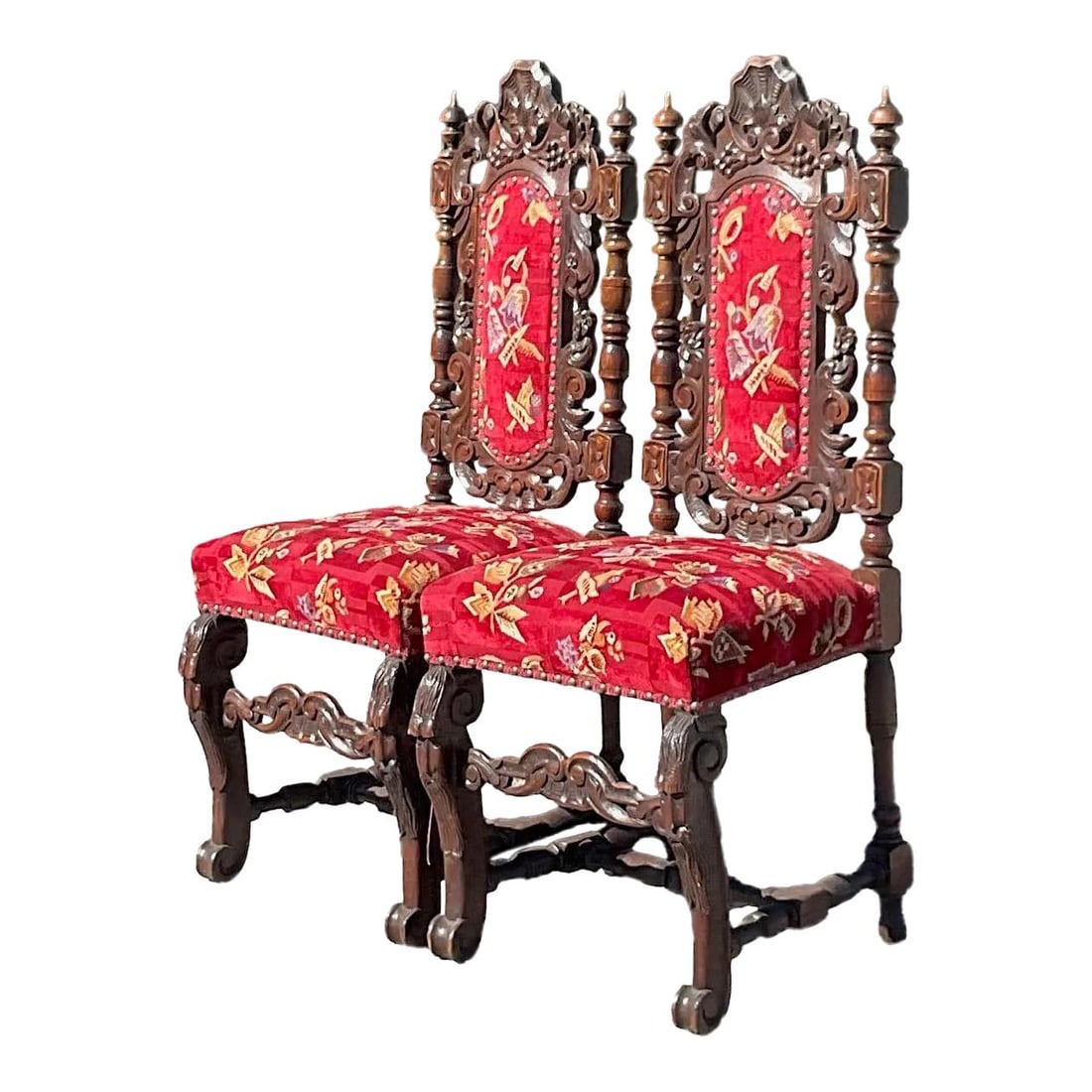 Vintage Gothic Hand Carved Dining Chairs - Pair: Vintage Gothic Hand Carved Dining Chairs - Pair This exquisite pair of vintage Gothic dining chairs showcases beautiful hand-carved details in a classic Gothic style. The seats are upholstered in a br