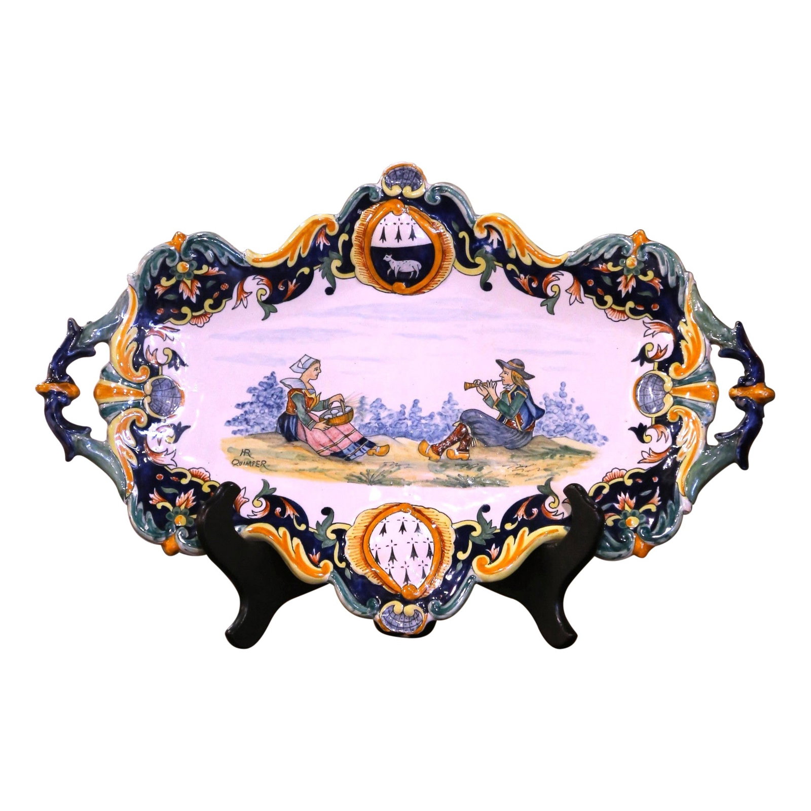 Henriot Quimper Early 20th Century Hand-Painted Faience Wall Platter: Henriot Quimper Early 20th Century Hand-Painted Faience Wall Platter This exquisite Early 20th Century French Painted Faience Wall Platter, signed by Henriot Quimper, is a stunning addition to any dec