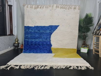 Handmade Moroccan Berber Wool Rug 9.84 x 6.56 Feet Soft White Blue Yellow: Handmade Moroccan Berber Wool Rug 9.84 x 6.56 Feet Soft White Blue Yellow Discover the exquisite charm of this Fabulous Soft Handmade Moroccan Berber Wool Rug. Featuring a beautiful blend of three