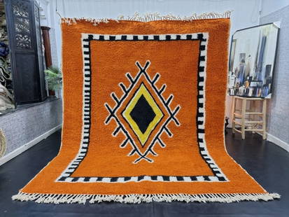 Authentic Moroccan Berber Wool Rug 9.84 x 6.56 Feet: Authentic Moroccan Berber Wool Rug 9.84 x 6.56 Feet Experience the elegance of this authentic soft brown handwoven Moroccan Berber wool rug. Crafted by local Berber women weavers in the Atlas