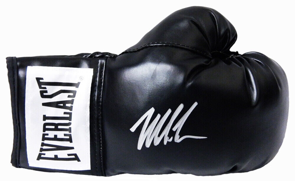 Mike Tyson Signed Everlast Black Boxing Glove with COA: Mike Tyson Signed Everlast Black Boxing Glove with COA This is a full-size boxing glove signed by the legendary Mike Tyson, a prominent figure in the boxing world. The glove is from Everlast and featu