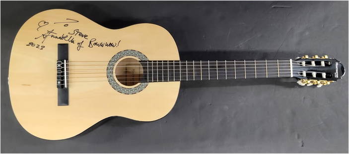 Annabella Lwin Autographed Acoustic Guitar Beckett Authenticated: Annabella Lwin Autographed Acoustic Guitar Beckett Authenticated This is a pre-owned acoustic guitar autographed by Annabella Lwin, featuring a personalized inscription "To Steve... Boww wow! 2023".