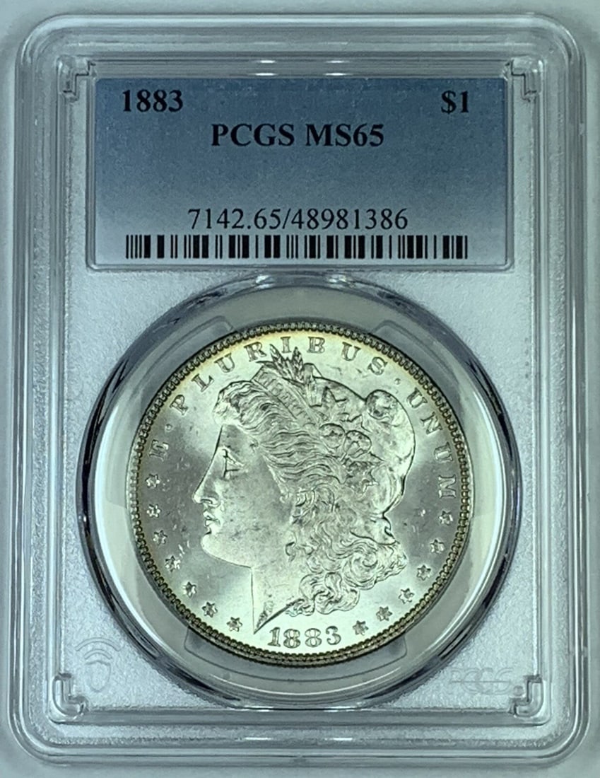 1883 Morgan Silver Dollar Coin PCGS MS 65 Uncirculated: 1883 Morgan Silver Dollar Coin PCGS MS 65 Uncirculated This 1883 Morgan Silver Dollar is a remarkable piece of numismatic history. Graded MS 65 by PCGS, this uncirculated coin showcases the iconic Mor
