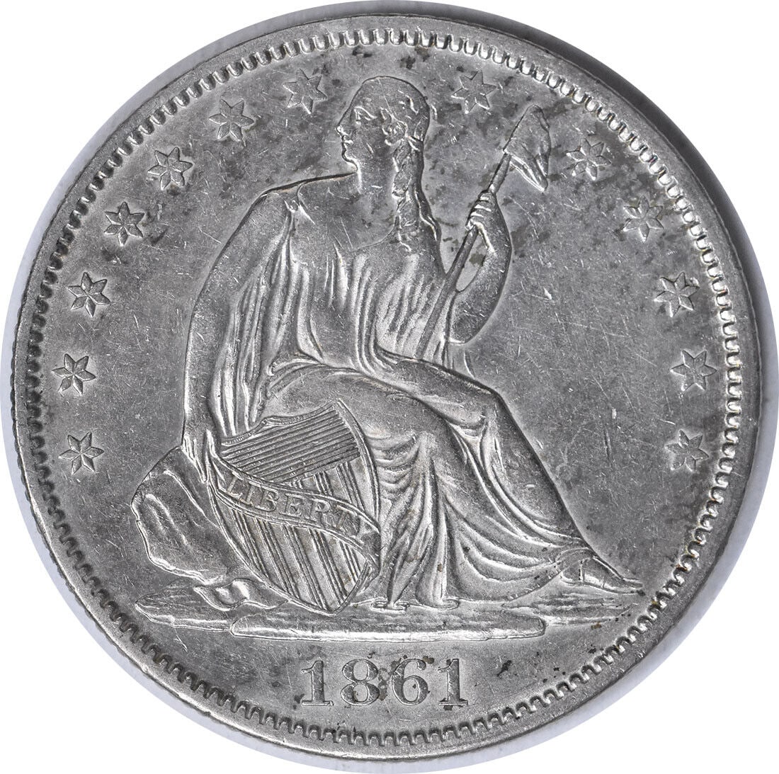 1861-O Liberty Seated Half Dollar AU Uncertified 90% Silver Coin: 1861-O Liberty Seated Half Dollar AU Uncertified 90% Silver Coin This 1861-O Liberty Seated Silver Half Dollar features a beautiful design by Thomas Sully and Christian Gobrecht. Struck at the New Orl