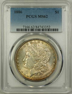 1886 Morgan Silver Dollar Coin PCGS MS62 Uncirculated Silver: 1886 Morgan Silver Dollar Coin PCGS MS62 Uncirculated Silver This 1886 Morgan Silver Dollar $1 Coin is a stunning addition for any numismatist or collector. Graded MS 62 by PCGS, this uncirculated